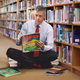 Image for article titled Arne Duncan Spends Visit To Local Elementary School Looking At UFO Books In Library